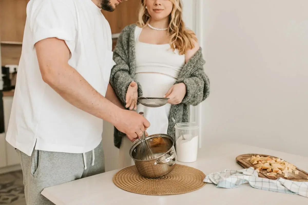 A household cooking together in the kitchen